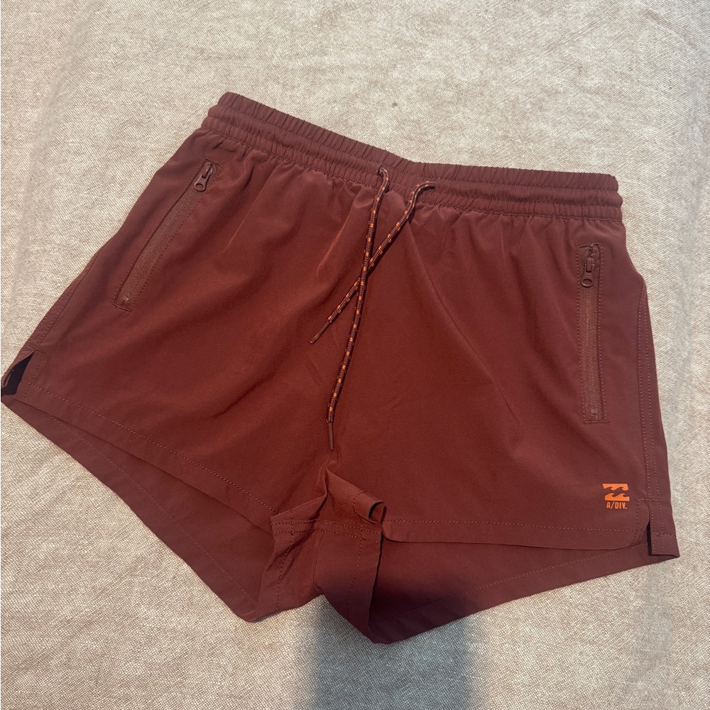 Billabong Women's Athletic Shorts in Deep Maroon with Orange Logo